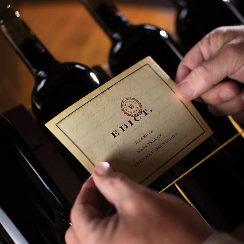 Labeling a bottle by hand in Napa Valley